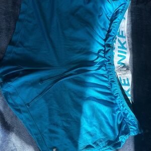 Blue Nike Dri Fit short cuts
